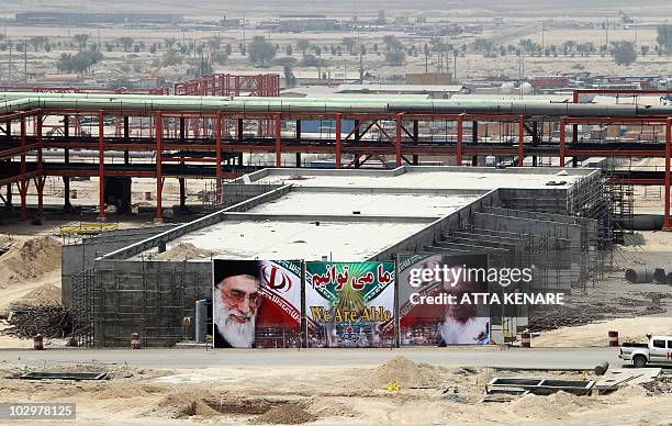 Huge banner bearing portraits of Iran's supreme leader Ayatollah Ali Khamenei and his predecessor, the founder of the Islamic republic, Ayatollah...