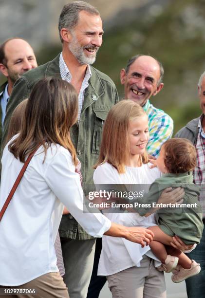 King Felipe VI of Spain, Queen Letizia of Spain, Princess Sofia of Spain and Princess Leonor of Spain carrying a baby attend the Centenary of the...