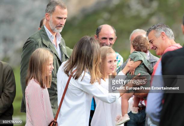 King Felipe VI of Spain, Queen Letizia of Spain, Princess Sofia of Spain and Princess Leonor of Spain carrying a baby attend the Centenary of the...