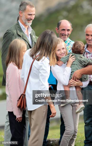 King Felipe VI of Spain, Queen Letizia of Spain, Princess Sofia of Spain and Princess Leonor of Spain carrying a baby attend the Centenary of the...