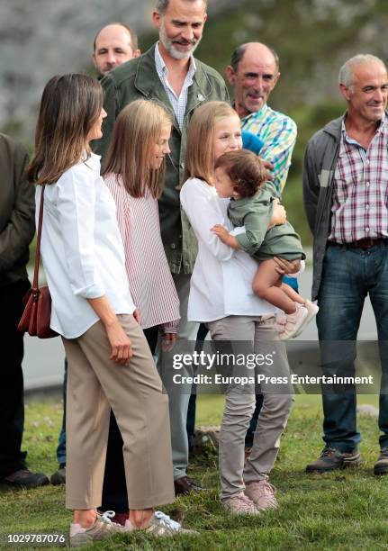 King Felipe VI of Spain, Queen Letizia of Spain, Princess Sofia of Spain and Princess Leonor of Spain carrying a baby attend the Centenary of the...