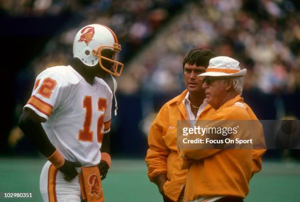 Quarterback Doug Williams of the Tampa Bay Buccaneers talking with Head Coach John McKay circa 1978 during an NFL football game. Williams played for...