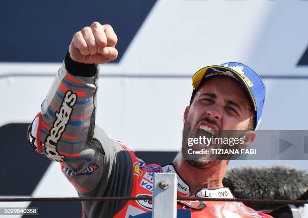 Ducati Team's Italian rider Andrea Dovizioso celebrates victory on podium of the MotoGP race of the San Marino Grand Prix at the Marco Simoncelli...