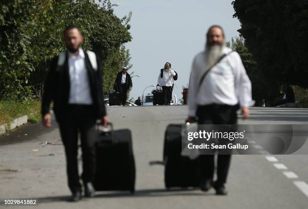 Hassidic Jews arrive with their suitcases prior to the annual Rosh Hashanah celebration on September 9, 2018 in Uman, Ukraine. Tens of thousands of...