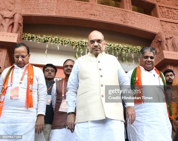 President Amit Shah leaves with Bhupender Yadav and Arun Singh leave after BJP National Executive Meeting at Ambedkar Bhawan, on September 9, 2018 in...