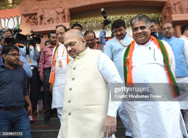 President Amit Shah leaves with Bhupender Yadav Arun Singh and Manoj Tiwari leave after BJP National Executive Meeting at Ambedkar Bhawan, on...