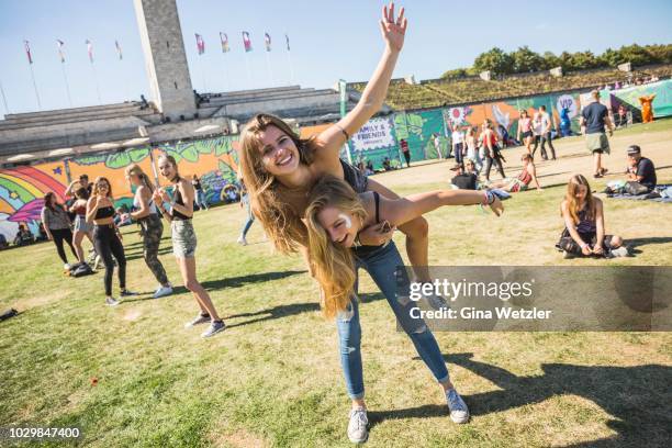 Fans pose during the Lollapalooza festival at the Olympiagelände on September 9, 2018 in Berlin, Germany.