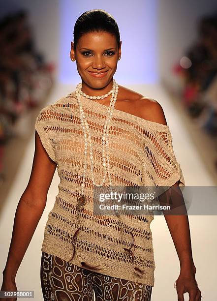 Designer Veronique de la Cruz walks the runway at the Aquarella Swimwear 2011 fashion show during Mercedes-Benz Fashion Week Swim at the Raleigh on...