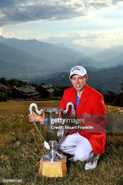 Matthew Fitzpatrick of England celebrates with the trophy after winning The Omega European Masters at Crans-sur-Sierre Golf Club on September 9, 2018...