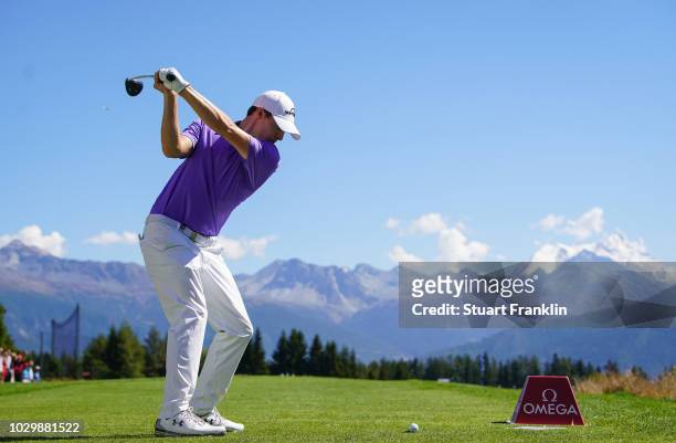 Matthew Fitzpatrick of England plays a shot on the seventh hole during the final round of the Omega European Masters at Crans-sur-Sierre Golf Club on...