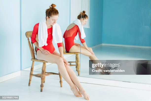 long-legged dancer resting - woman full length mirror stock pictures, royalty-free photos & images