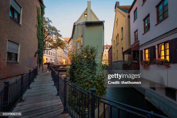 pedestrian bridge over crossing of the middle and back lech canal, augsburg, germany - augsburgo fotografías e imágenes de stock