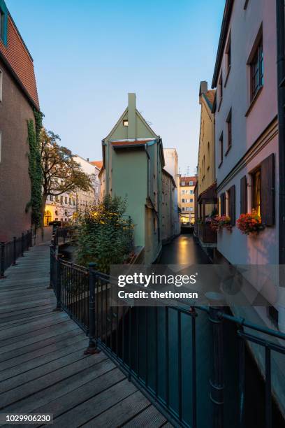 pedestrian bridge over crossing of the middle and back lech canal, augsburg, germany - lech stock-fotos und bilder