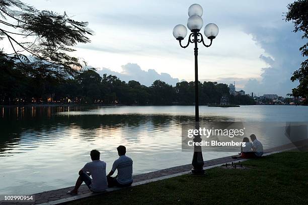 The sun sets over Hoan Kiem Lake ahead of the 43rd Association of Southeast Asian Nations Minsterial Meeting in Hanoi, Vietnam, on Monday, July 19,...