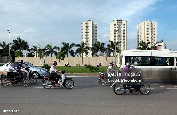 Traffic moves down a street ahead of the 43rd Association of Southeast Asian Nations Minsterial Meeting in Hanoi, Vietnam, on Monday, July 19, 2010....