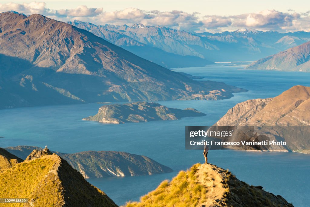 Man on Roys Peak lookout, New Zealand.