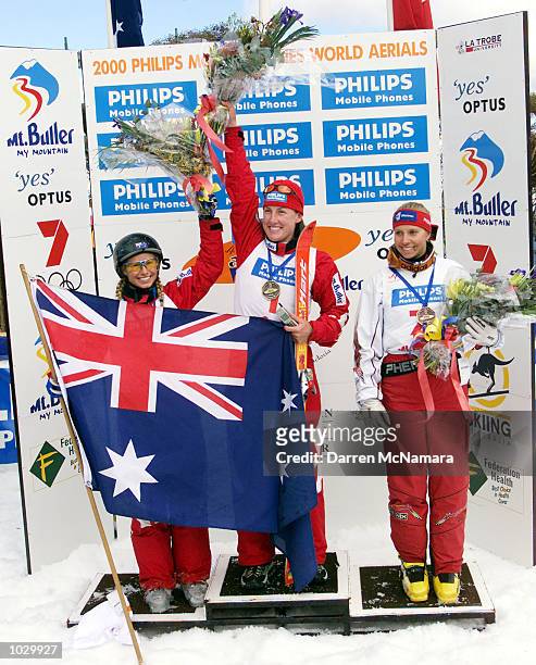 Alisa Camplin, Jacqui Cooper and Veronika Beauer celebrate after finishing first, second and third in the second round of the World Cup season,...