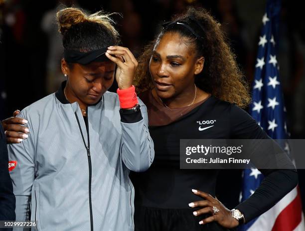 Naomi Osaka of Japan cries after winning the Women's Singles finals match alongside runner up Serena Williams of the United States on Day Thirteen of...