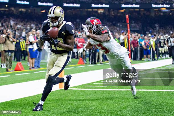 Ted Ginn Jr. #19 of the New Orleans Saints catches a touchdown pass over Carlton Davis III of the Tampa Bay Buccaneers at Mercedes-Benz Superdome on...