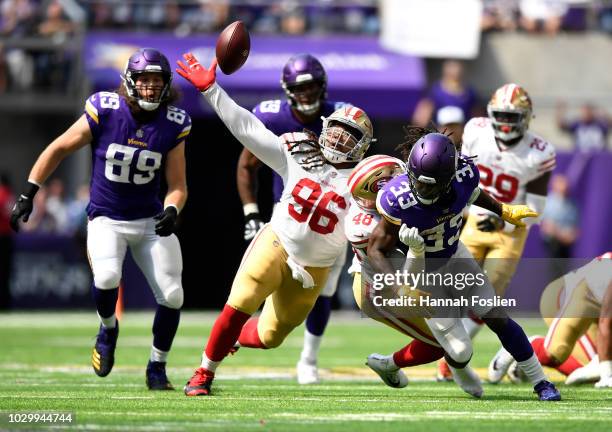 Dalvin Cook of the Minnesota Vikings fumbles the ball in the second quarter of the game against the San Francisco 49ers at U.S. Bank Stadium on...