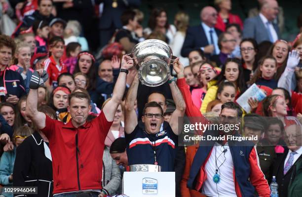 Dublin , Ireland - 9 September 2018; Brothers, from left, Logistics manager Damian, coach Kevin and manager Paudie Murray lift the cup following the...