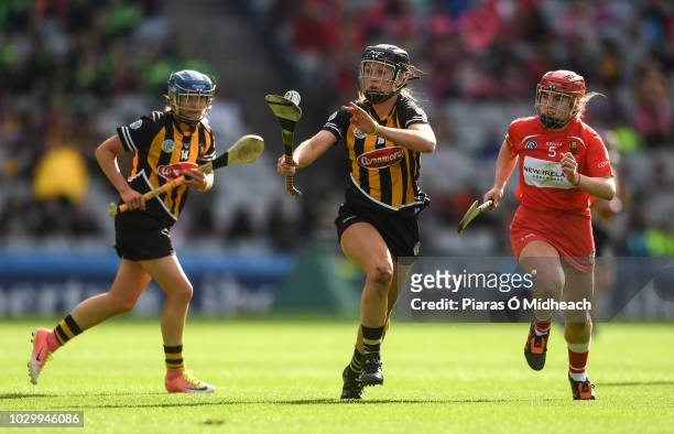 Dublin , Ireland - 9 September 2018; Julie Ann Malone of Kilkenny, supported by team mate Michelle Quilty, left, in action against Libby Coppinger of...