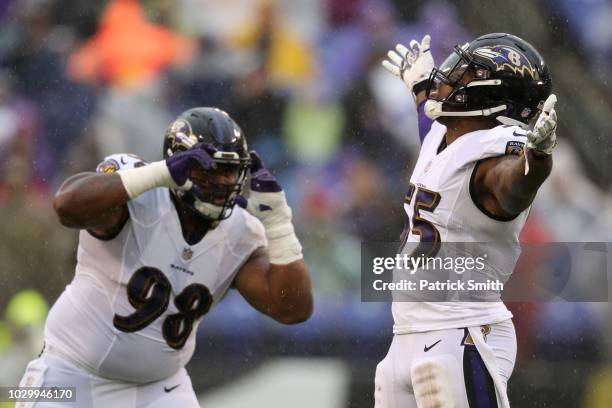 Terrell Suggs and Brandon Williams of the Baltimore Ravens celebrate after a sack in the second quarter against the Buffalo Bills at M&T Bank Stadium...