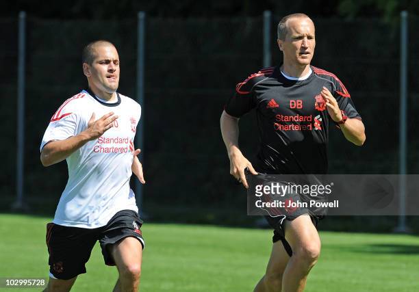 LIverpool FC new signing Joe Cole with Darren Burgess head of fitness and conditioning during a training session at the club's pre-season Swiss...