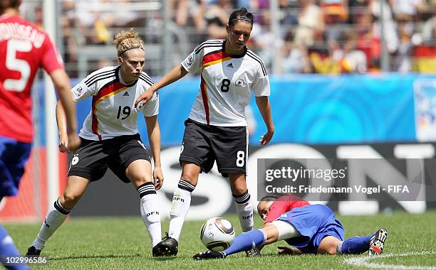 Kim Kulig and Selina Wagner of Germany and Ines Jaurena of France battle for the ball during the FIFA U20 Women's World Cup Group A match between...