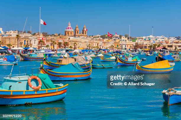 colourful boats in marsaxlokk malta - malta harbour stock pictures, royalty-free photos & images