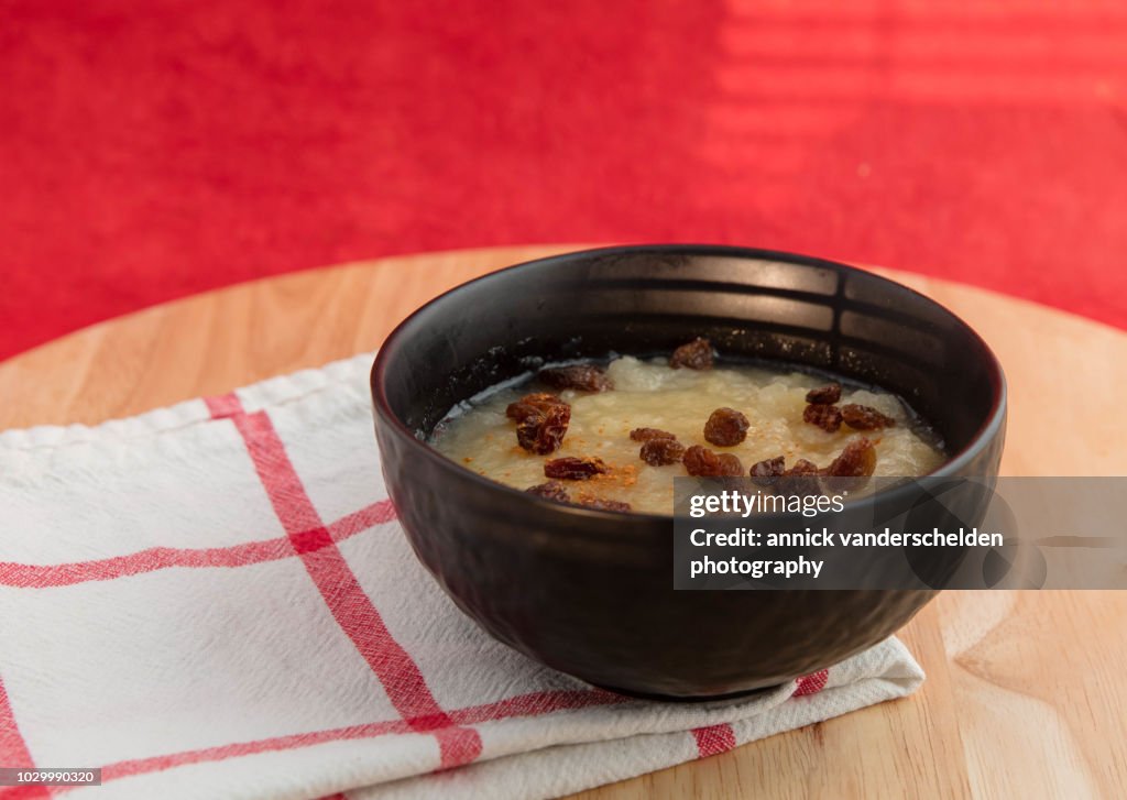 Bowl of applesauce with raisins and cinnamon