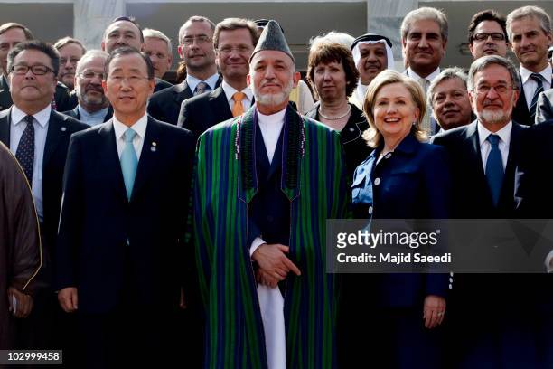 Afghan President Hamid Karzai poses with United Nations Secretary, General Ban Ki-moon to his right and US Secretary of State, Hillary Clinton to his...