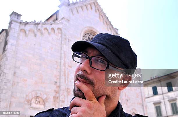 Italian painter Giuseppe Veneziano poses next to the Dome of Pietrasanta in Palazzo Panichi which is staging his latest major exhibition "Zeitgeist"...