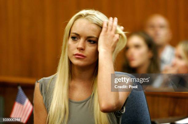 Actress Lindsay Lohan surrenders at the Beverly Hills Courthouse to serve her 90 day jail sentence on July 20, 2010 in Beverly Hills, California....