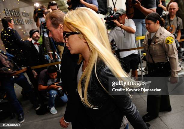 Actress Lindsay Lohan arrives at the Beverly Hills Courthouse to surrender to serve her 90 day jail sentence on July 20, 2010 in Beverly Hills,...