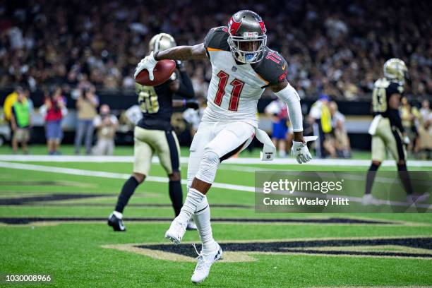 DeSean Jackson of the Tampa Bay Buccaneers celebrates in the end zone with a dance after catching a touchdown pass against the New Orleans Saints at...