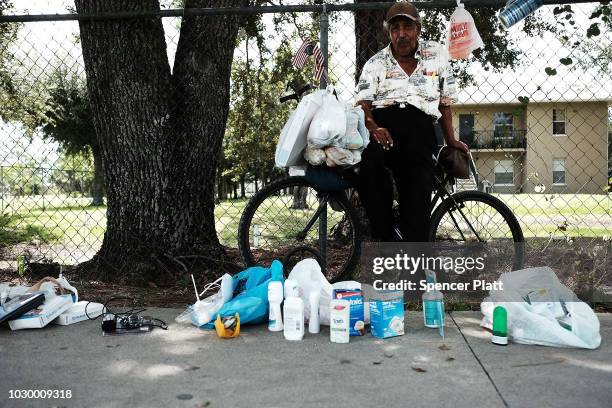 Ruben Benvs sells items along a street in the rural agriculture community of Immokalee on September 9, 2018 in Immokalee, Florida. The Immokalee...