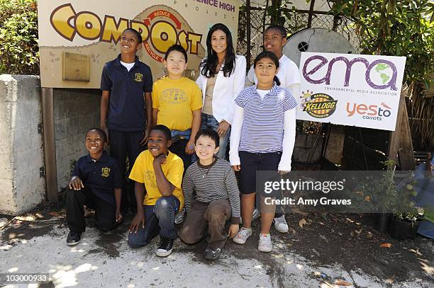 Emmanuelle Chriqui poses for a photo with children attending the Environmental Media Association and Yes to Carrots Garden Luncheon at The Learning...