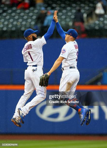 Amed Rosario and Brandon Nimmo of the New York Mets celebrate their 6-4 win over the Philadelphia Phillies during a game at Citi Field on September...