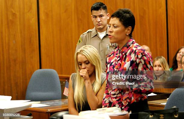 Actress Lindsay Lohan and lawyer Shawn Chapman Holley speak in court during Lindsay Lohan surrender at the Beverly Hills Courthouse to serve her 90...