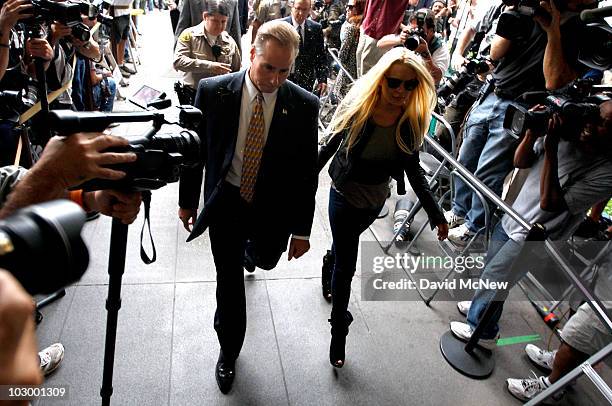 Actress Lindsay Lohan arrives at the Beverly Hills Courthouse to surrender to serve her 90 day jail sentence on July 20, 2010 in Beverly Hills,...