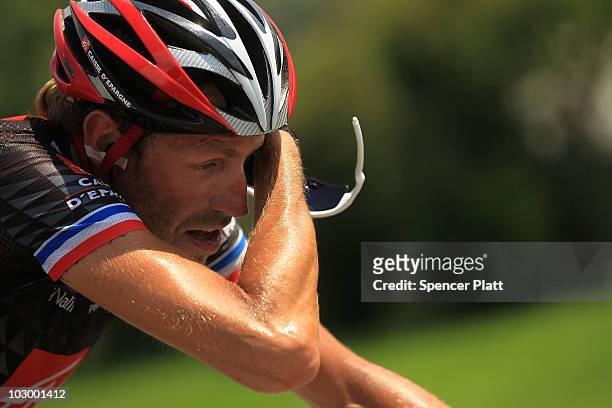 French rider Christophe Moreau wipres his brow while riding with the breakaway during stage 16 of the Tour de France on July 20, 2010 in Pau, France....