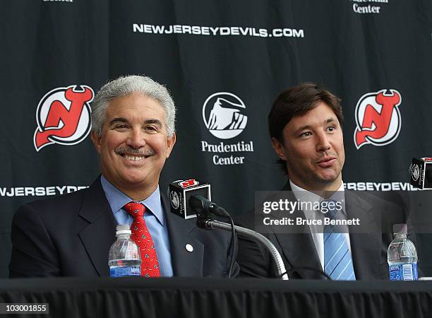 Team owner Jeff Vanderbeek and Ilya Kovalchuk of the New Jersey Devils field questions during a media opportunity announcing Kovalchuk's contract...