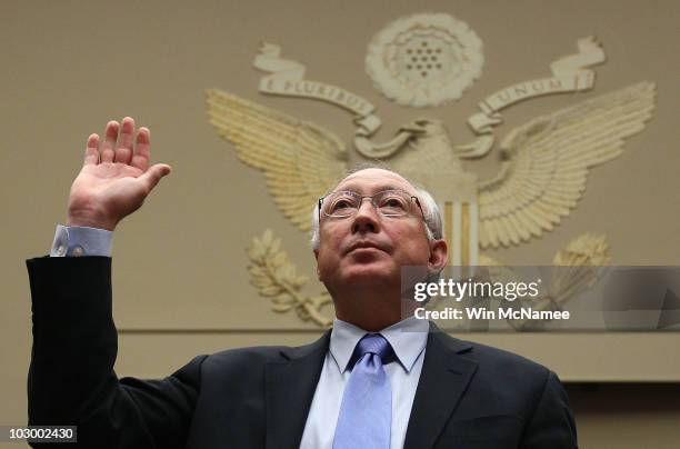 Interior Secretary Ken Salazar is sworn in prior to testimony before the House Energy and Commerce Committee and Energy and Environment...