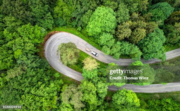 extreme curve ,country road - pivot stock pictures, royalty-free photos & images