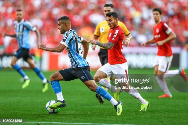 Uendel of Internacional battles for the ball against Alisson of Gremio during the match between Internacional and Gremio as part of Brasileirao...