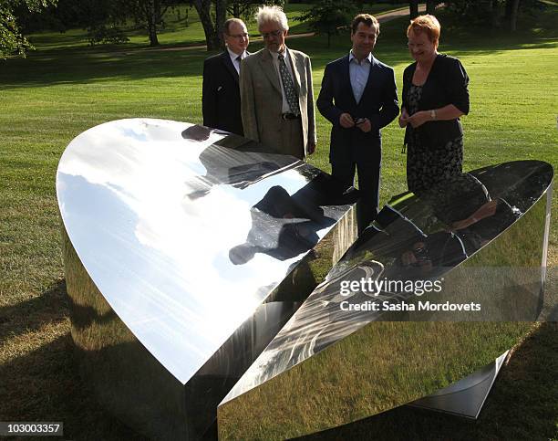 Russian President Dmitry Medvedev , Finland's President Tarja Halonen and her husband Juris Doktor Pentti Arajarvi are seen during their meeting on...