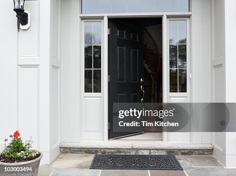 Front porch of house with front door open Front porch of house with front door open