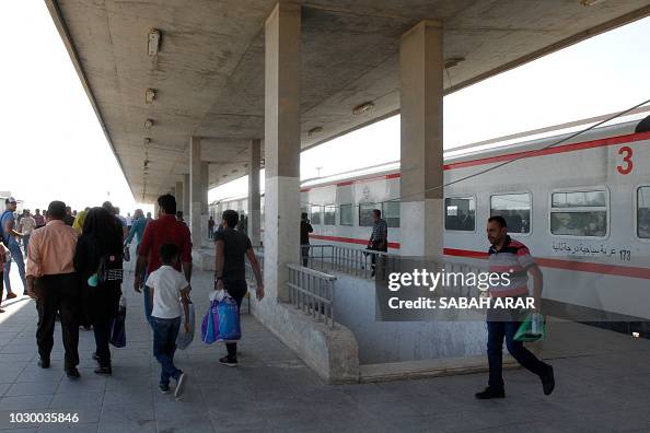 Iraq Train Rote Iraqi passengers disembark from a train coming from Baghdad as it ...