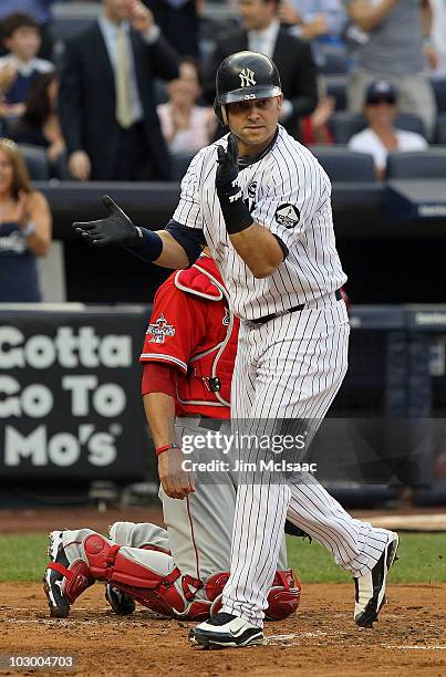 Nick Swisher of the New York Yankees celebrates his first inning home run against the Los Angeles Angels of Anaheim on July 20, 2010 at Yankee...